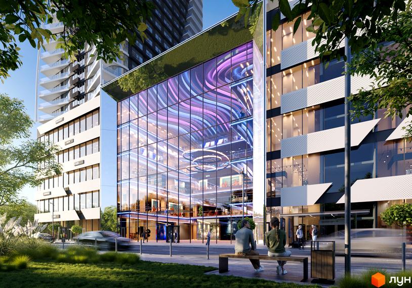 Житловий комплекс Aura city з фасадом зі скла та зеленим дахом. Поруч розташовані дерева та доглянута прибудинкова територія.