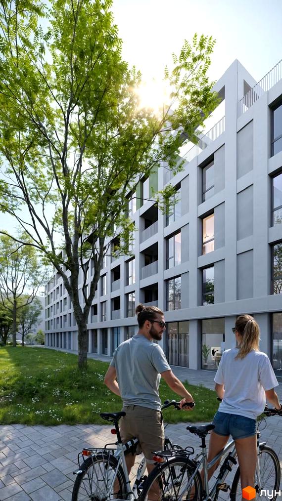 Багатоповерховий будинок Житлового комплексу Green Hill City з сірими фасадами та великими вікнами, поруч зелена територія з деревами та доріжкою.