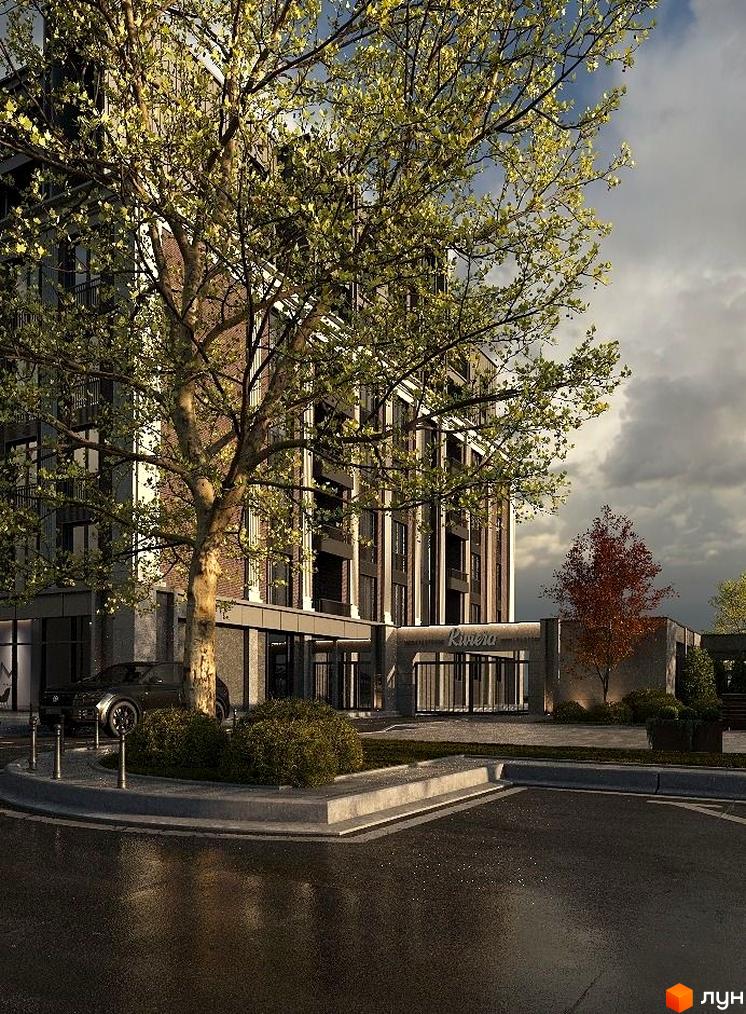 Апарт-готель Riviera aparts з цегляним фасадом та великим деревом на прибудинковій території. Парковка та зелені насадження біля входу.