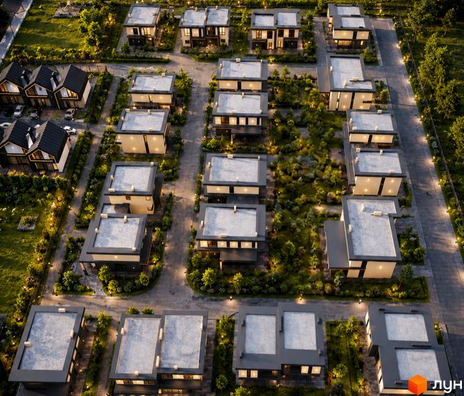 Котеджне містечко BEREZIVKA city з будинками з плоскими та скатними дахами, освітленими вулицями та зеленими насадженнями.