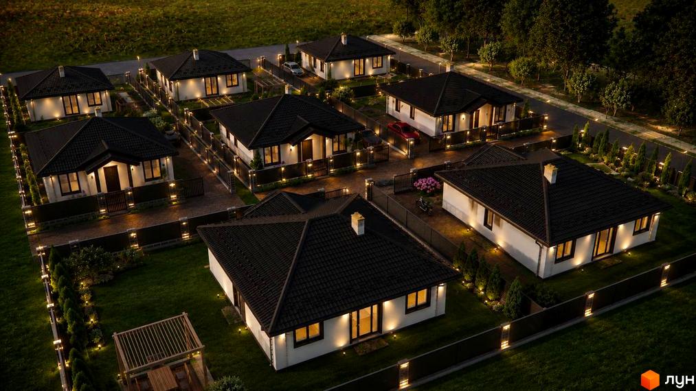 Котеджне містечко КМ Ozera Residence: одноповерхові будинки з темними дахами та підсвіченими фасадами, огороджені ділянки з газоном та освітленням.