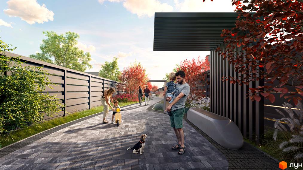Котеджне містечко КМ Piemont eco village. Сімейна прогулянка з дітьми та собакою по доглянутій прибудинковій території з червоними деревами та сучасною огорожею.