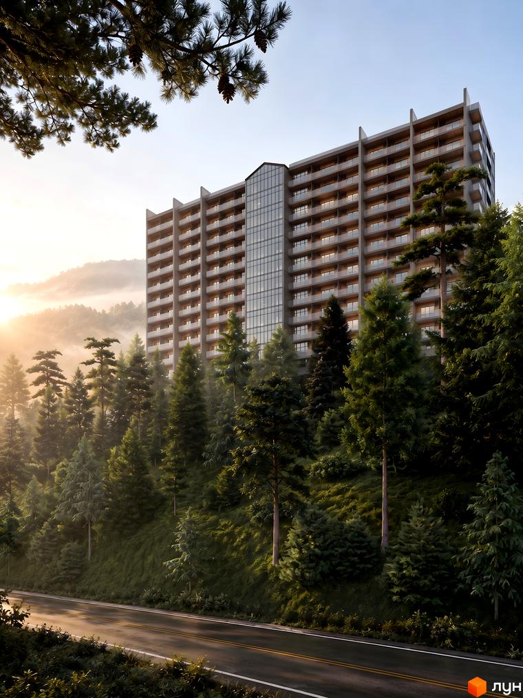 Багатоповерховий житловий комплекс AMA APARTMENTS з балконами та скляним фасадом, оточений хвойним лісом на схилі гори.