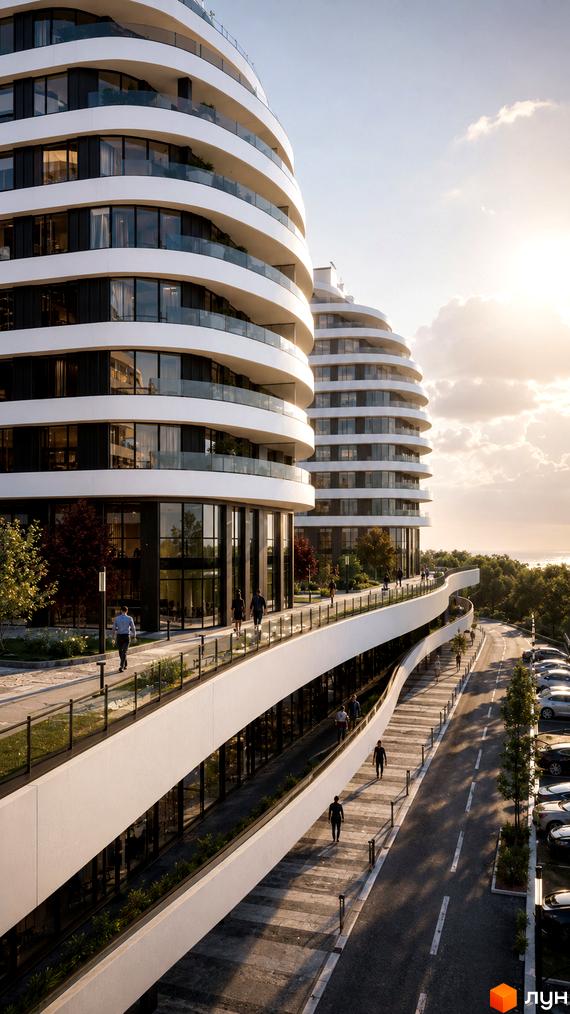 Житловий комплекс SvitLand Residences з вигнутими фасадами та скляними балконами, облаштована прибудинкова територія з доріжками та парковкою.