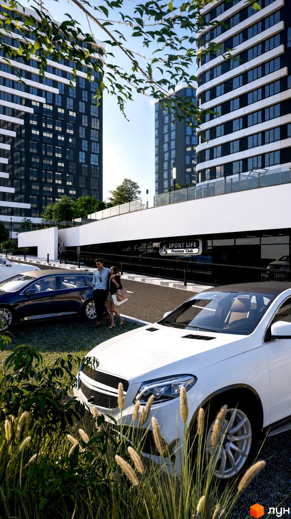 Житловий комплекс SvitLand Residences з високими будівлями та паркінгом. Прибудинкова територія з автомобілями та зеленню.