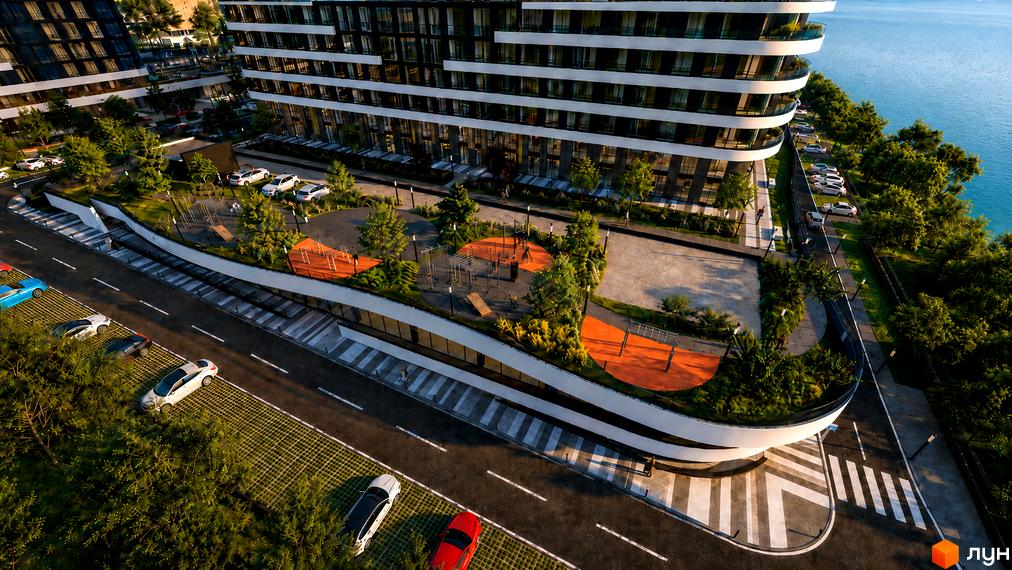 Житловий комплекс SvitLand Residences з вигнутими балконами та зеленою прибудинковою територією з дитячим майданчиком та місцями для відпочинку.