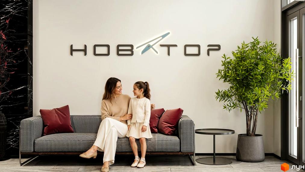 Зона відпочинку Житлового комплексу Новатор: жінка з дитиною на дивані, логотип на стіні, велика зелена рослина.