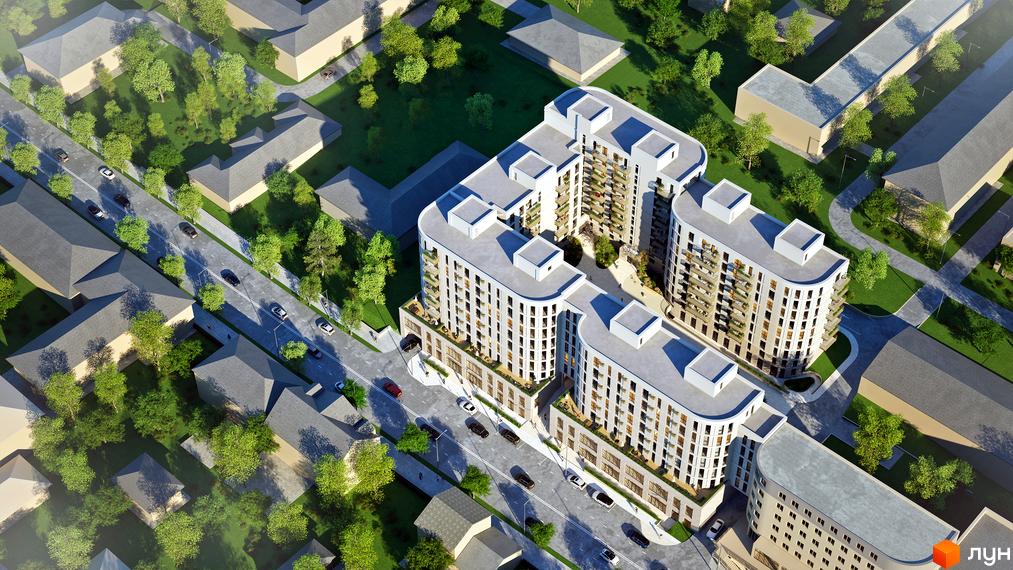 Житловий комплекс Amber з висоти пташиного польоту: білі багатоповерхові будинки з округлими фасадами та внутрішнім двором, оточені зеленню та дорогою.
