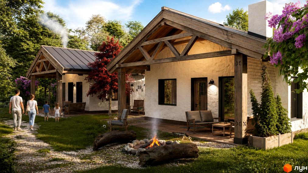 Котеджне містечко ПАВЗА Village and Spa: два будинки зі світлими стінами та дерев'яними балками, поруч зелена територія з вогнищем та стежкою.
