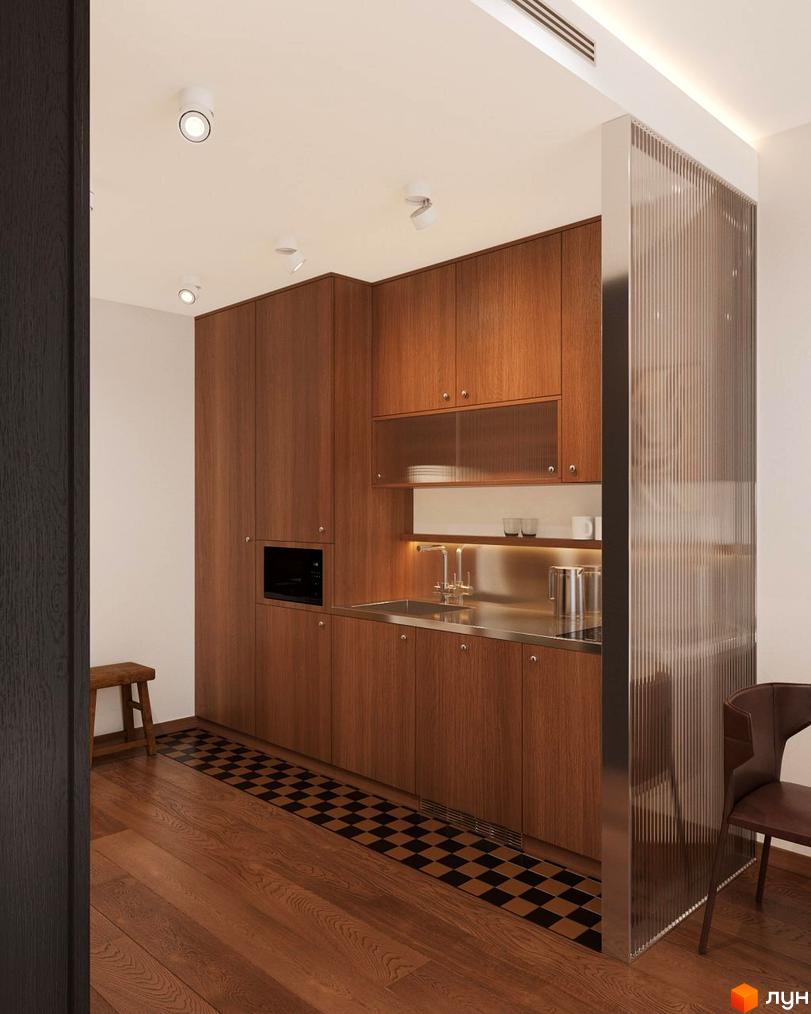 Кухня в Oselia apartments з дерев'яними меблями, вбудованою технікою та металевою стільницею. На підлозі паркет та чорно-білий килимок.