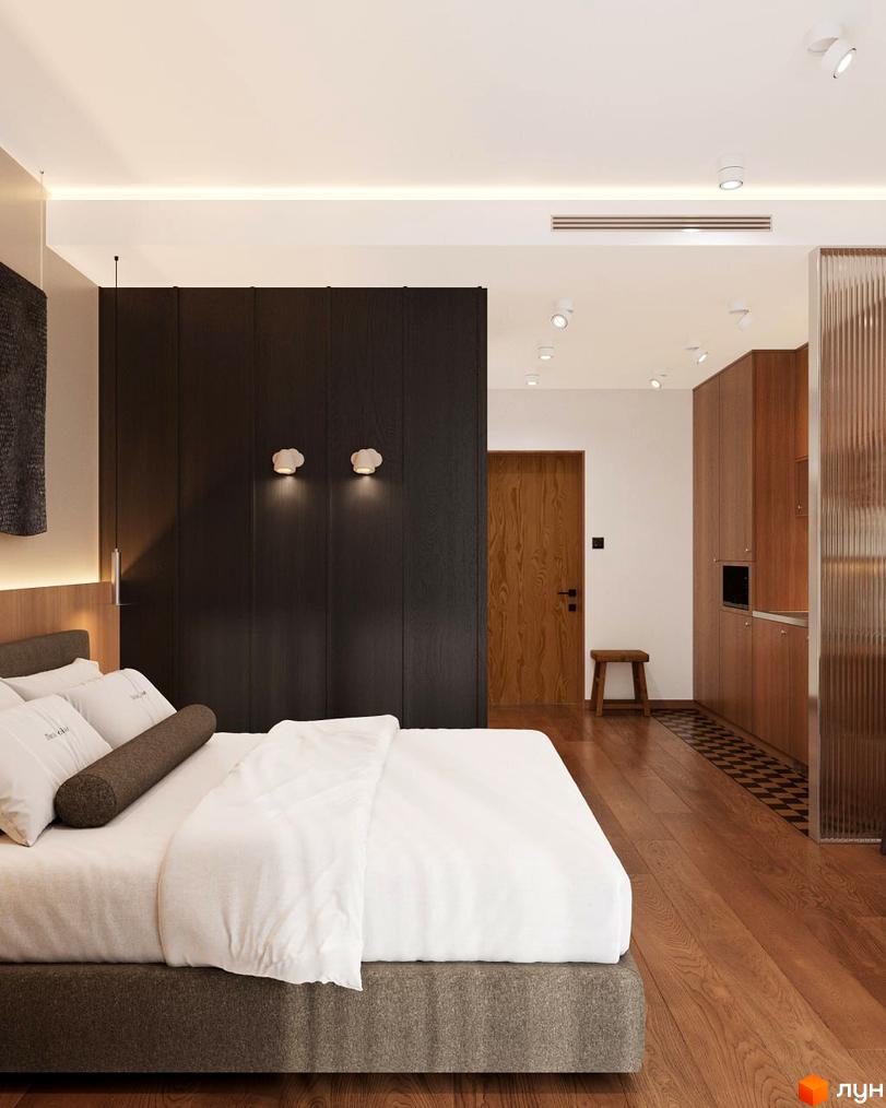 Oselia apartments: спальня з двоспальним ліжком та дерев'яними панелями, поруч кухня з шафами та вбудованою технікою.