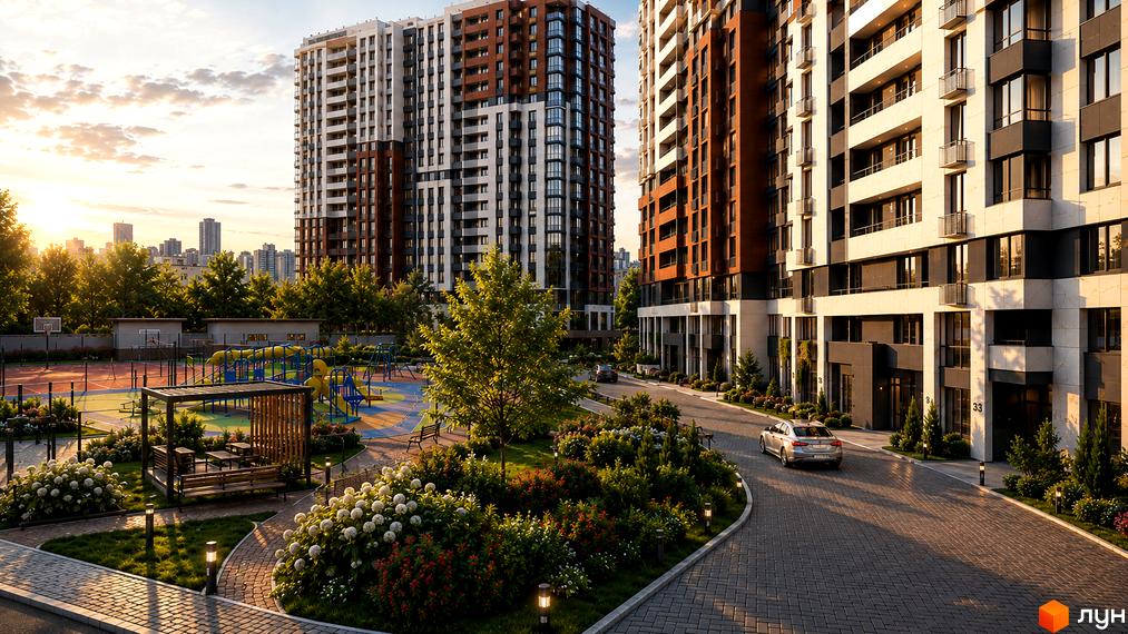 Житловий комплекс CITY HUB: високі будинки світлих та коричневих кольорів. Озеленена прибудинкова територія з дитячим майданчиком та доріжками.