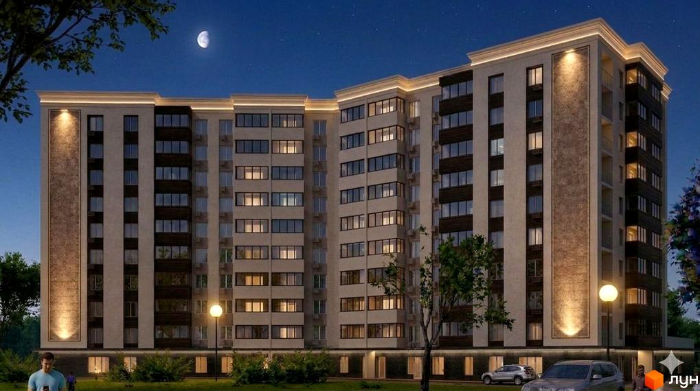 Житловий комплекс Сади Вишневі вночі. Багатоквартирний будинок з освітленими вікнами та фасадом, оточений зеленою територією.
