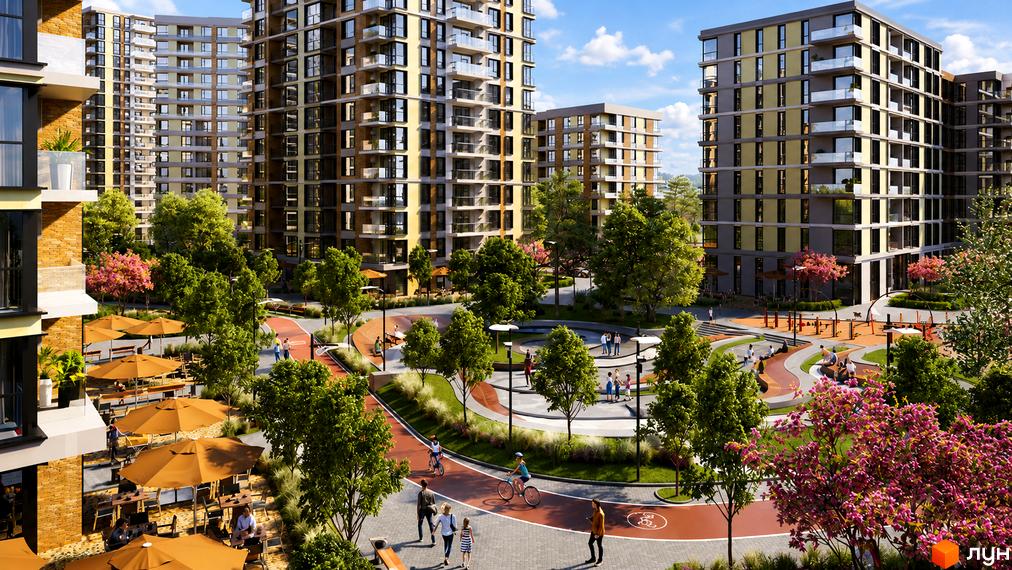 Житловий комплекс Krona Park II з багатоповерховими будинками та доглянутою прибудинковою територією з зонами відпочинку та дитячими майданчиками.