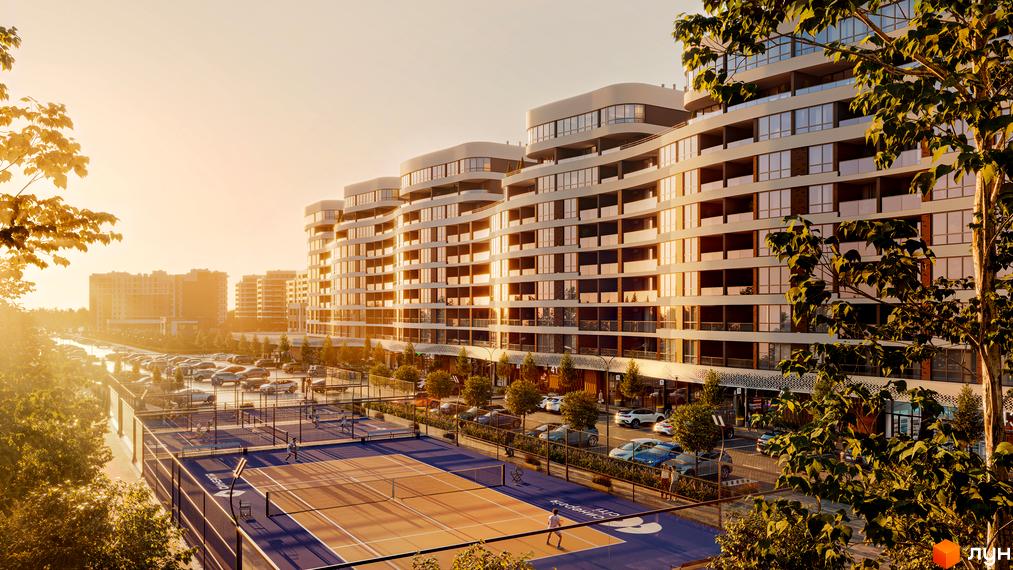 Житловий комплекс Синергія Сіті з вигнутими фасадами та панорамними вікнами, поруч тенісні корти та парковка.