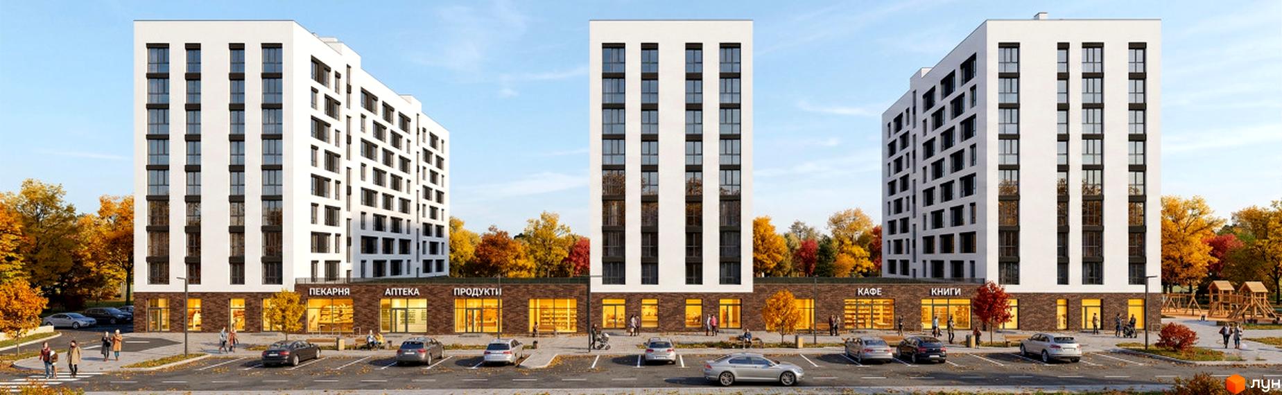 Житловий комплекс Yuvi city з білими будинками та комерційними приміщеннями на першому поверсі. Навколо осінні дерева, парковка та дитячий майданчик.