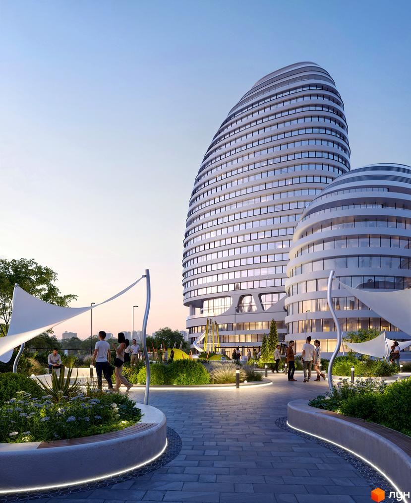БФК INTERGAL CITY з футуристичною архітектурою та облаштованою прибудинковою територією з зонами відпочинку та дитячим майданчиком.