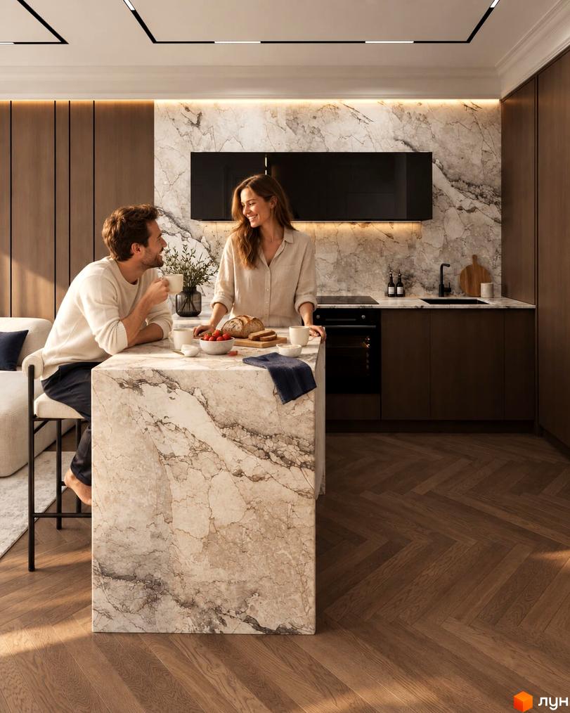 Затишна кухня з мармуровим островом у новобудові MONTE Residence Club, де пара насолоджується кавою.