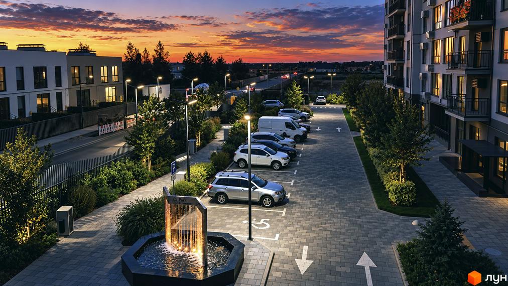 Житловий комплекс Park Residence: багатоповерховий будинок та двоповерхові будинки, освітлена прибудинкова територія з паркінгом та фонтаном.