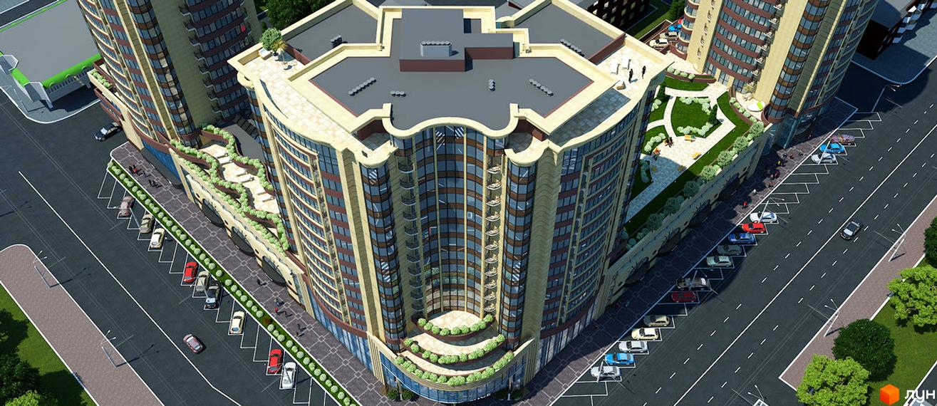 Зовнішній вигляд житлового комплексу Grand Palace з багатоповерховими будівлями та вигнутими фасадами. Навколо комплексу розташовані дороги та паркувальні місця.