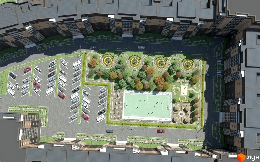 Вигляд зверху на Житловий район Набережний квартал: багатоповерхові будинки, паркінг, дитячий майданчик та озеленена територія.