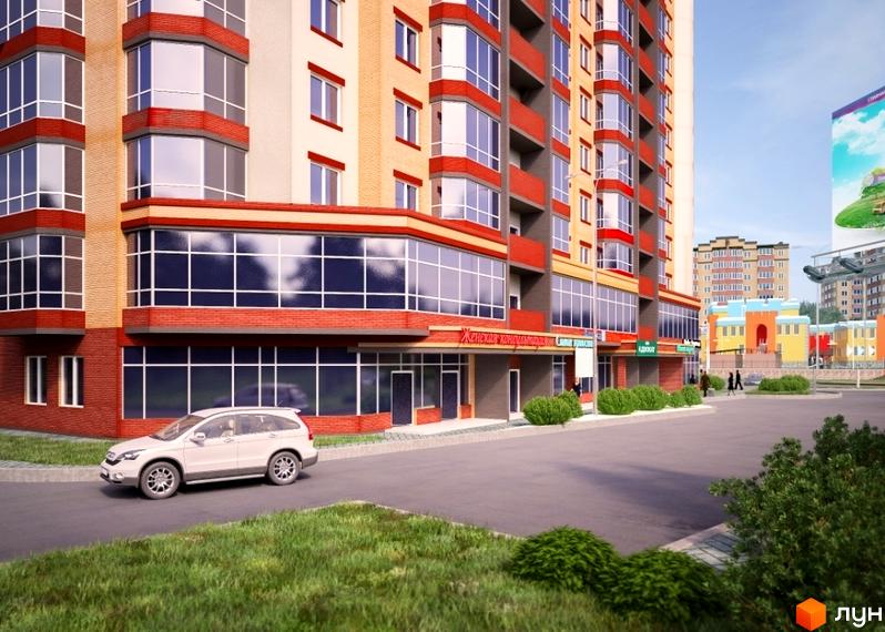 Житловий комплекс Панорамний 2 з червоними та бежевими фасадами, великими вікнами та прибудинковою територією з кущами та дорогою. На передньому плані видно білий автомобіль.