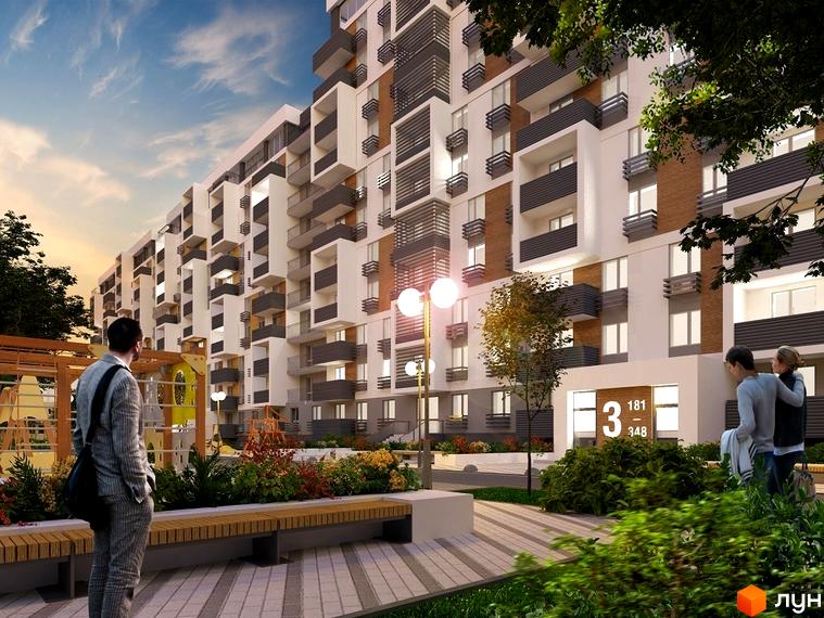 Зображення фасаду будівлі житлового комплексу Вишгород Сіті Парк. На передньому плані лавки та зелені насадження.