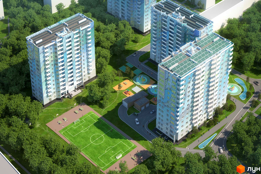 Житловий комплекс Новий дім Ньютона з яскравим фасадом та сонячними панелями на даху. На території розташовані дитячі майданчики та футбольне поле.