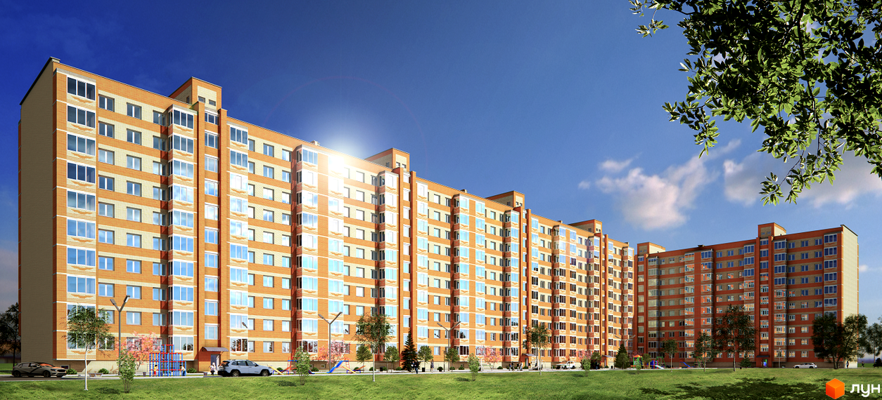 Житловий комплекс Spring Town: багатосекційний будинок з помаранчево-бежевим фасадом та зеленою прибудинковою територією з дитячим майданчиком.