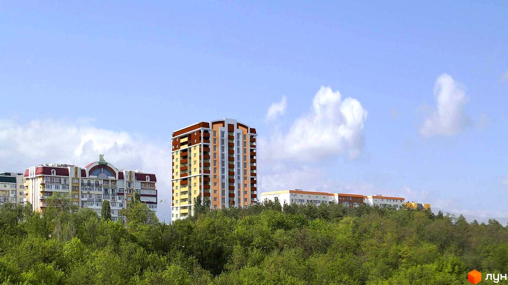 Житловий комплекс Балакірєва: багатоповерхові будинки з червоними та жовтими фасадами, розташовані на тлі блакитного неба з хмарами. Навколо комплексу зелені дерева та пагорби.