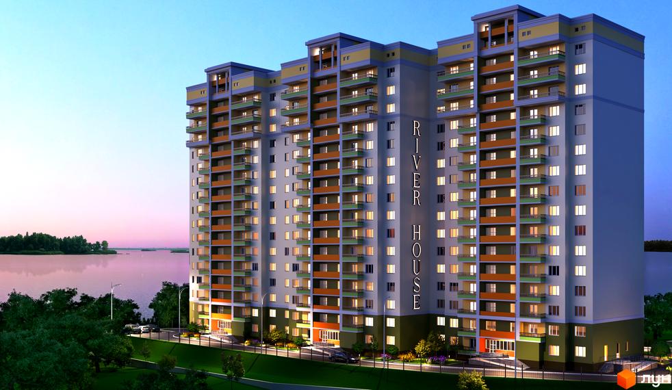 Зовнішній вигляд житлового комплексу River House з балконами та вікнами, що світяться. Навколо будинку зелена територія з деревами та дорогою.