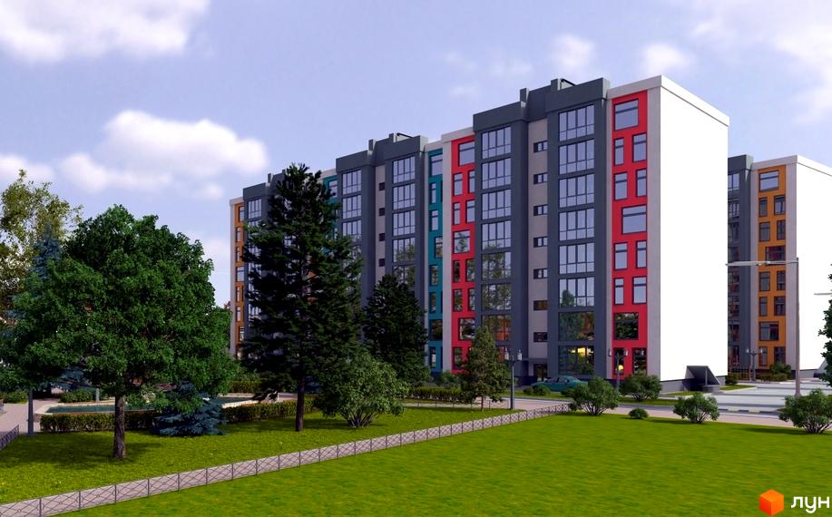 Житловий комплекс Сімейний квартал з яскравими фасадами та великими вікнами. Навколо будинку зелена галявина, дерева та доріжки.