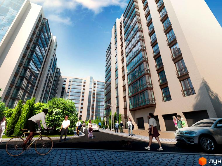 Зображення комплексу Сімейний Lux з багатоповерховими будинками та прибудинковою територією. На передньому плані люди та велосипедист.