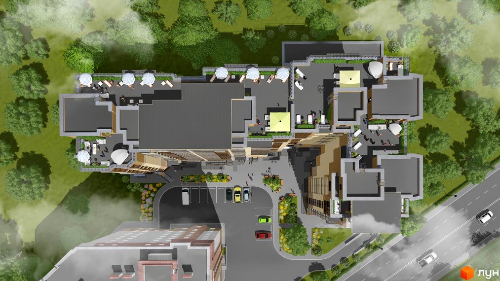 Зображення зверху Житлового комплексу Княжий з терасами на даху. Навколо будинку зелені насадження, парковка з автомобілями.