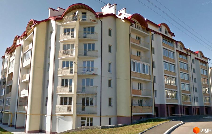 Зображення фасаду будинку Житлового комплексу на вул. Джона Леннона, 37. Багатоповерхова будівля з балконами та червоним дахом.