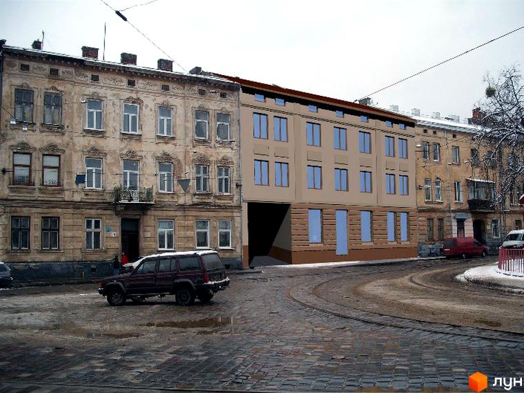 Новобудова на вул. Гайдамацькій, 12а: бежева будівля з прямокутними вікнами, розташована вздовж вулиці з бруківкою та трамвайними коліями.