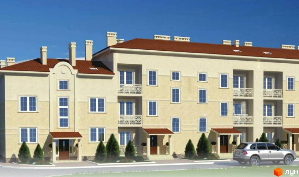 Зовнішній вигляд триповерхових будинків житлового комплексу Материк з червоним дахом та численними вікнами. Поруч розташовані зелені насадження та припаркований автомобіль.