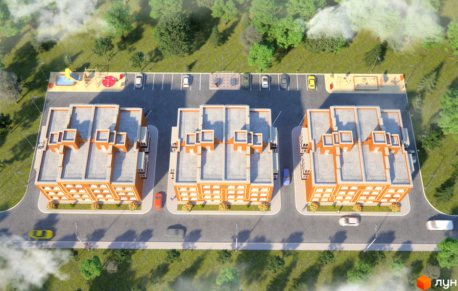 Вид зверху на житловий комплекс Затишний Хотів. Зображено триповерхові будинки з помаранчевими фасадами, парковки та дитячі майданчики.