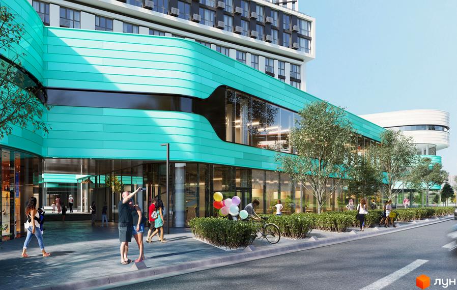 Житловий комплекс Славутич 2.0. Зовнішній вигляд будівлі з бірюзовим фасадом та скляними вікнами. Прибудинкова територія з деревами та людьми.