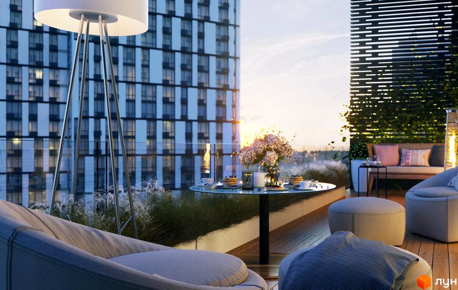Сучасний житловий комплекс Славутич 2.0 з терасою, меблями та квітами на заході сонця. Вид на високу будівлю з вікнами.