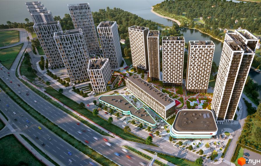 Житловий комплекс Славутич 2.0: вид зверху на багатоповерхові будинки з білими фасадами та прибудинкову територію з дорогою та озелененням.