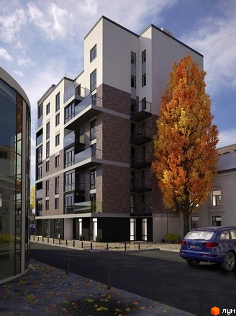 Житловий комплекс Park Hall Apartments з цегляним фасадом та скляними балконами. Поруч розташована осіннє дерево та синій автомобіль.