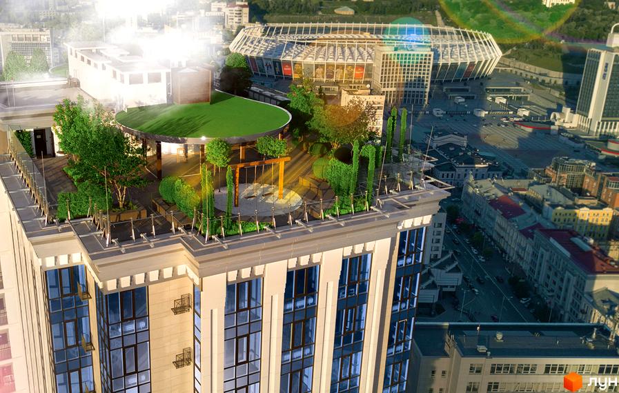 Будинок Royal Tower з численними вікнами та зеленою терасою на даху. Навколо стадіон та міська забудова.