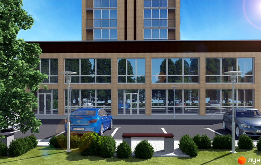 Житловий комплекс Статус Парк. Будівля з бежевим цегляним фасадом та великими вікнами, прибудинкова територія з парковкою, лавкою та зеленими насадженнями.