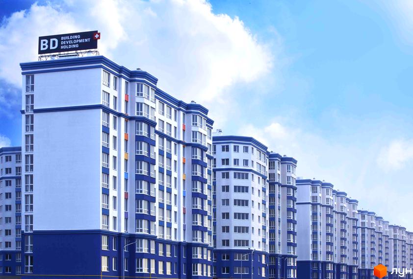 Житловий комплекс Львівський з сучасними багатоповерховими будинками та облаштованою прибудинковою територією.