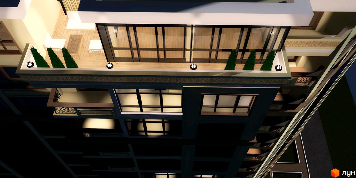 Вид зверху на Житловий комплекс Гетьманський Бровари: темний фасад, великі вікна та балкон з дерев'яною підлогою, меблями та зеленими насадженнями.