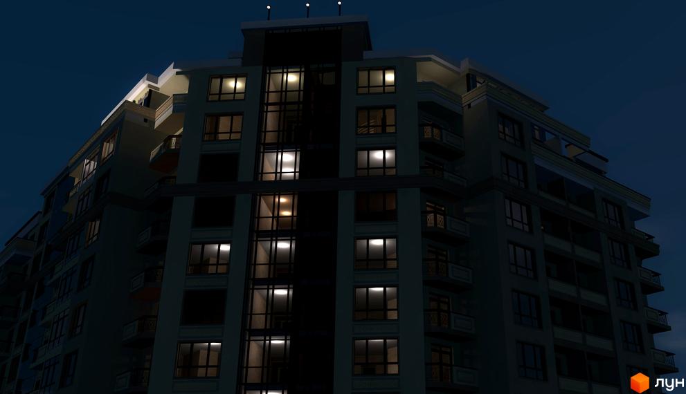 Нічний вигляд Житлового комплексу Гетьманський Бровари. Багатоквартирний будинок з освітленими вікнами та балконами.