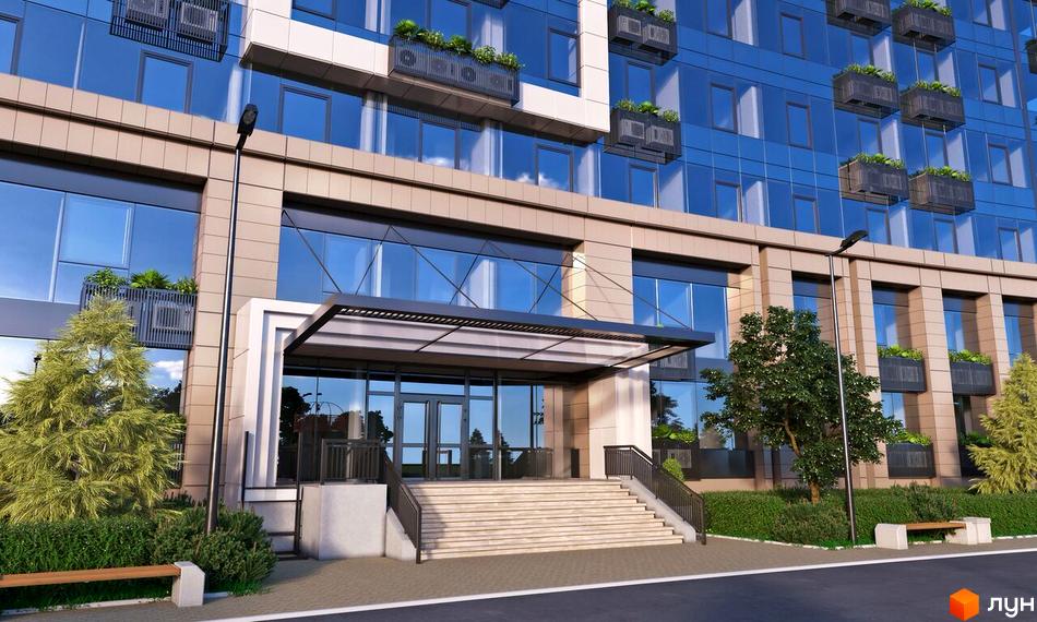 Фасад багатоповерхового будинку з панорамними вікнами та вхідною групою. На прибудинковій території розташовані дерева, лавки та газон.
