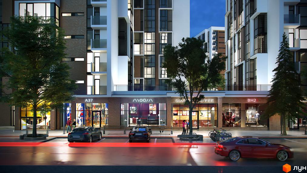 Житловий район Manhattan: фасади з цегли та білих елементів, багато вікон. На першому поверсі магазини, перед будинком вулиця з деревами та автомобілями.