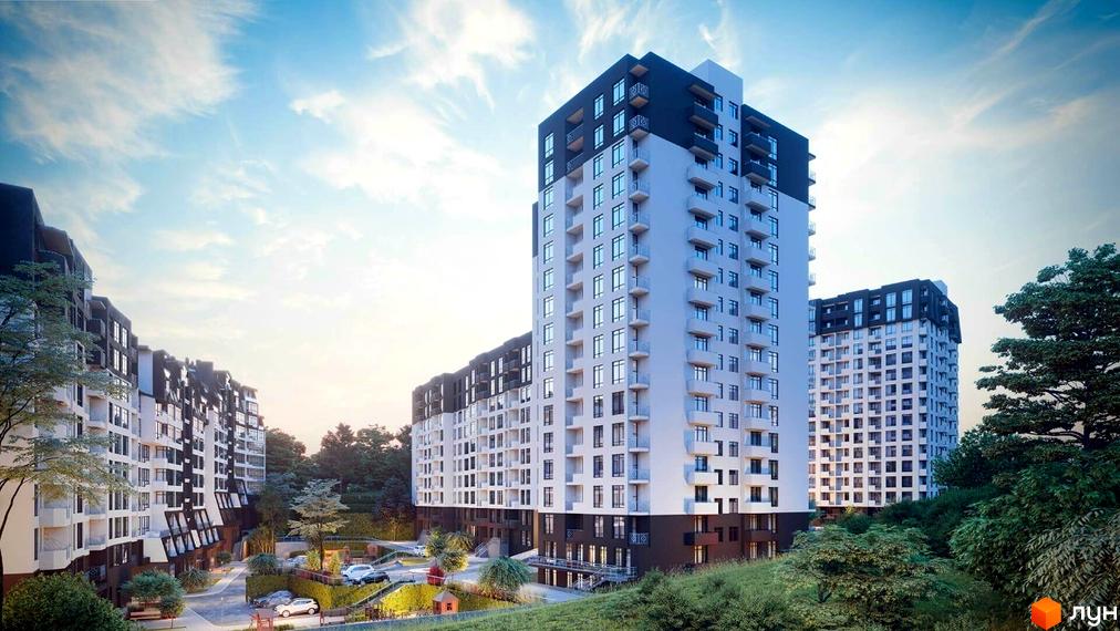 Житловий комплекс Львівський квартал з багатоповерховими будинками білого та темного кольору. Навколо зелені насадження та облаштована прибудинкова територія з парковкою.